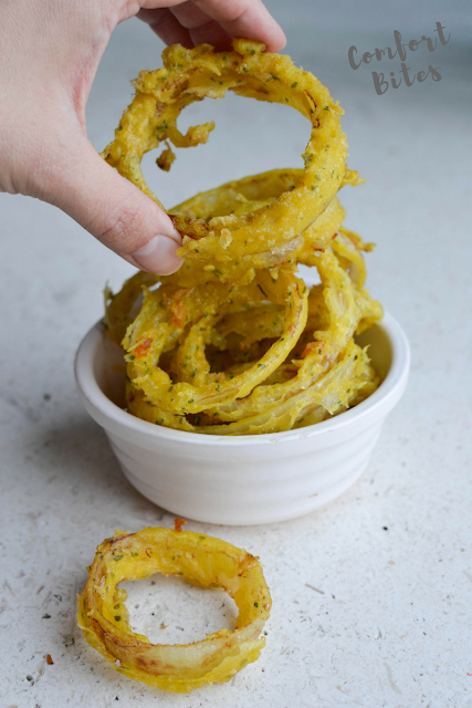 AIP paleo onion rings AIP paleo onion rings made from cassava flour piled up in a bowl