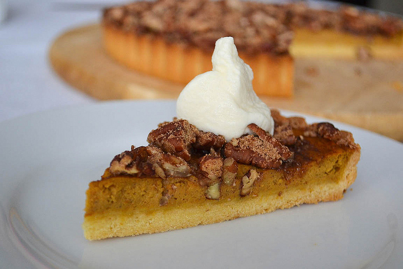 pumpkin pecan pie with whipped cream