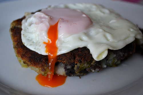 black pudding cabbage potato cake with fried egg